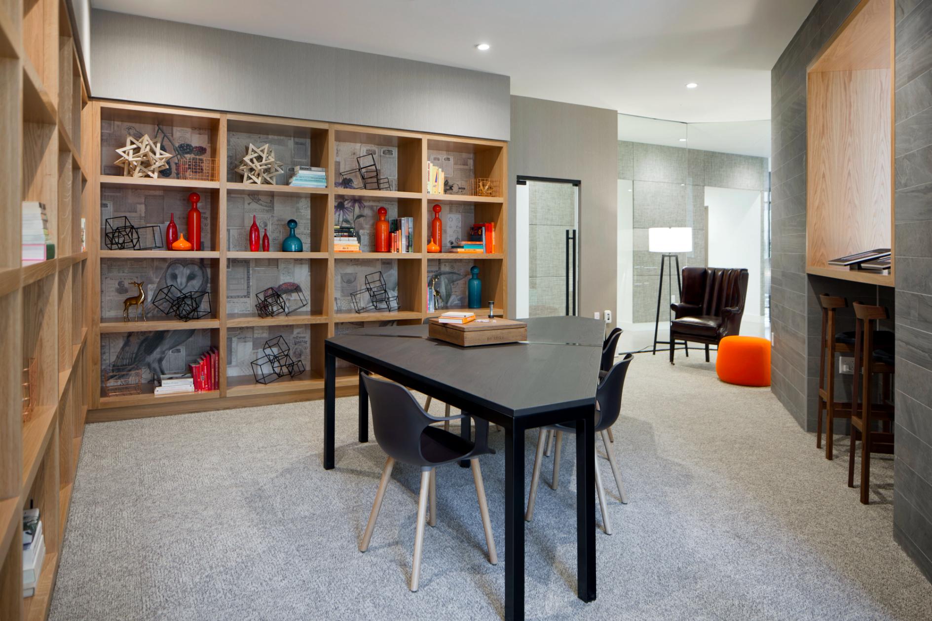 Game room with seating and community televisions