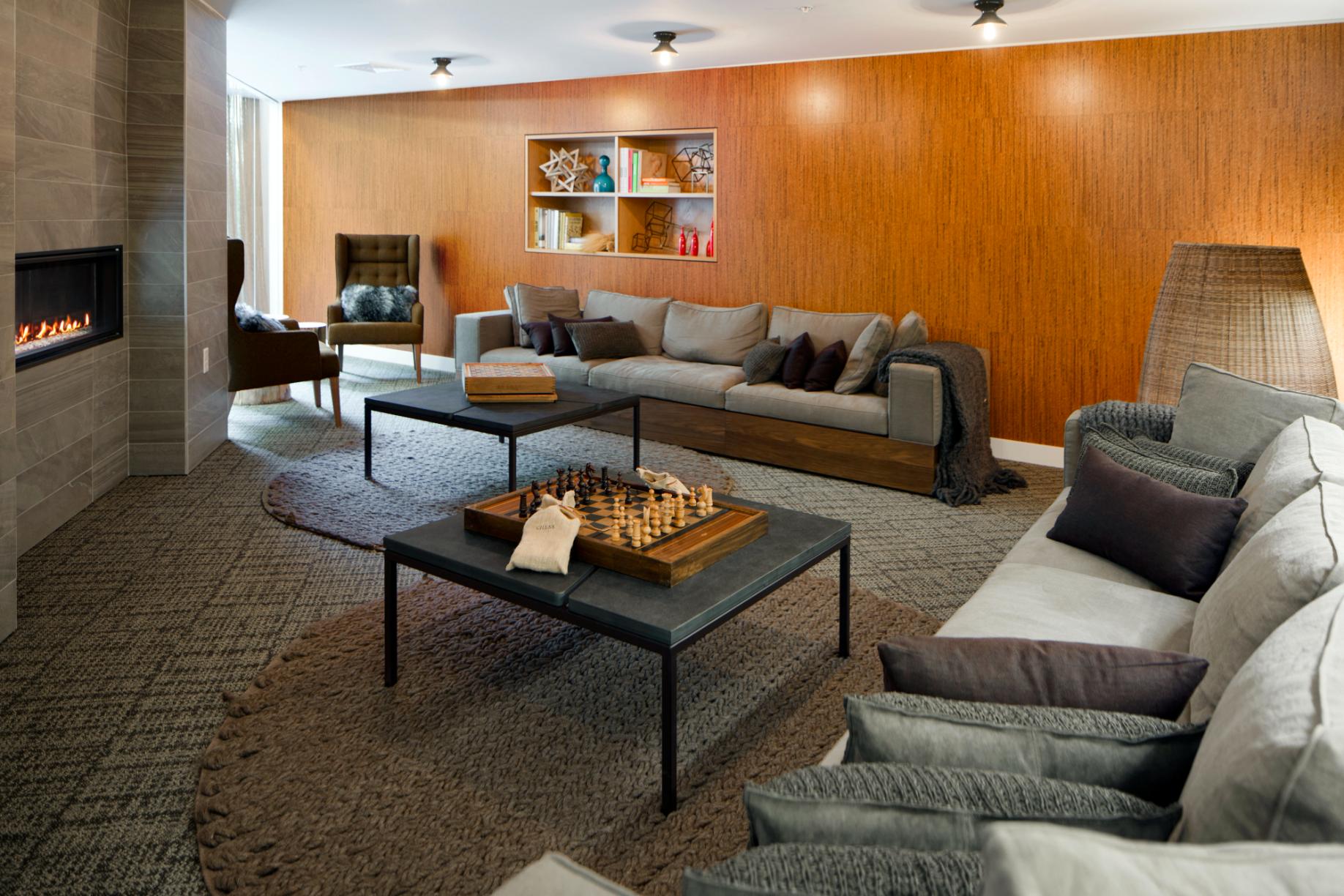 A cozy dining room featuring a wooden table surrounded by several chairs