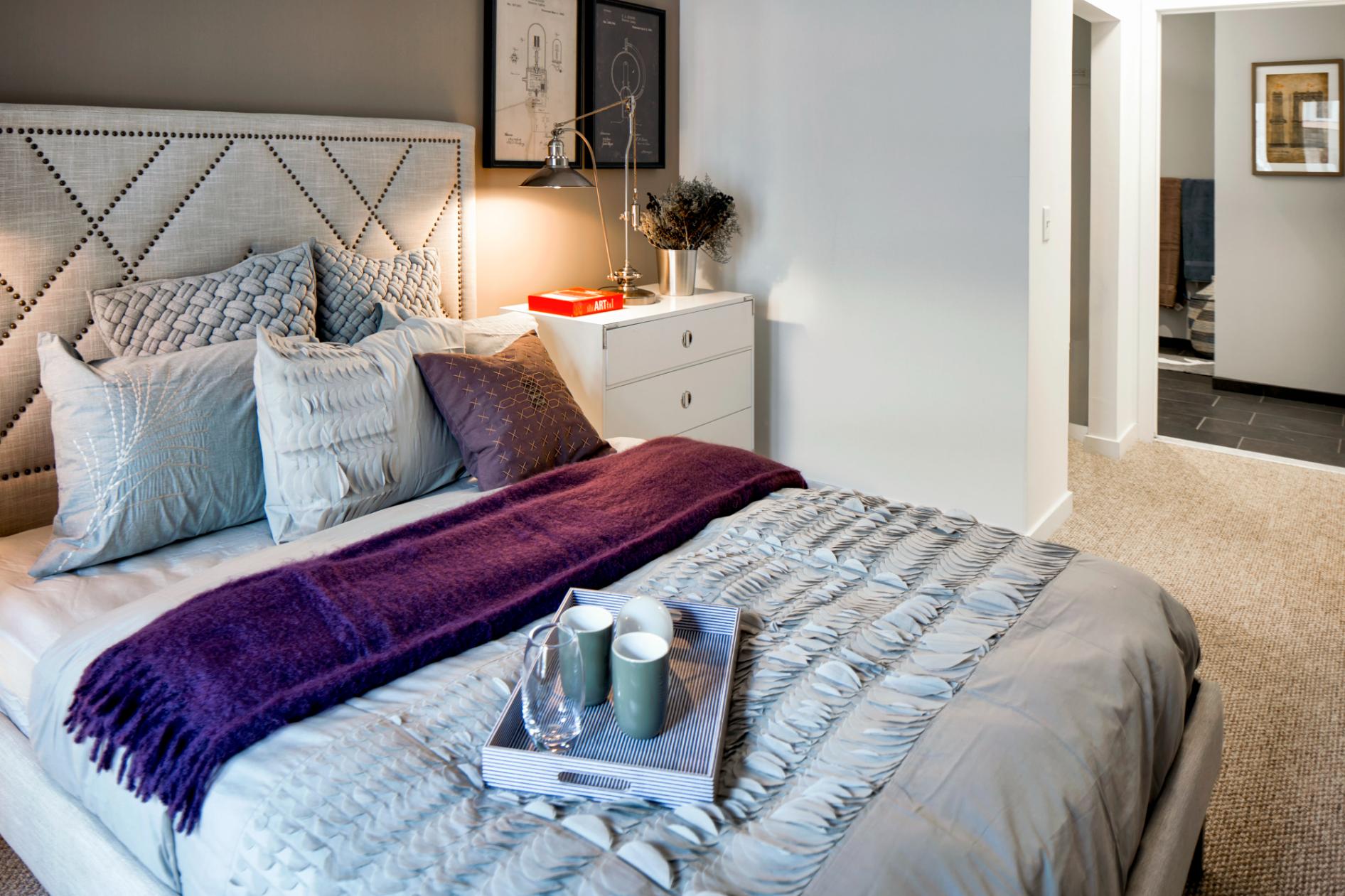 View of bedroom and hallway to bathroom and living area