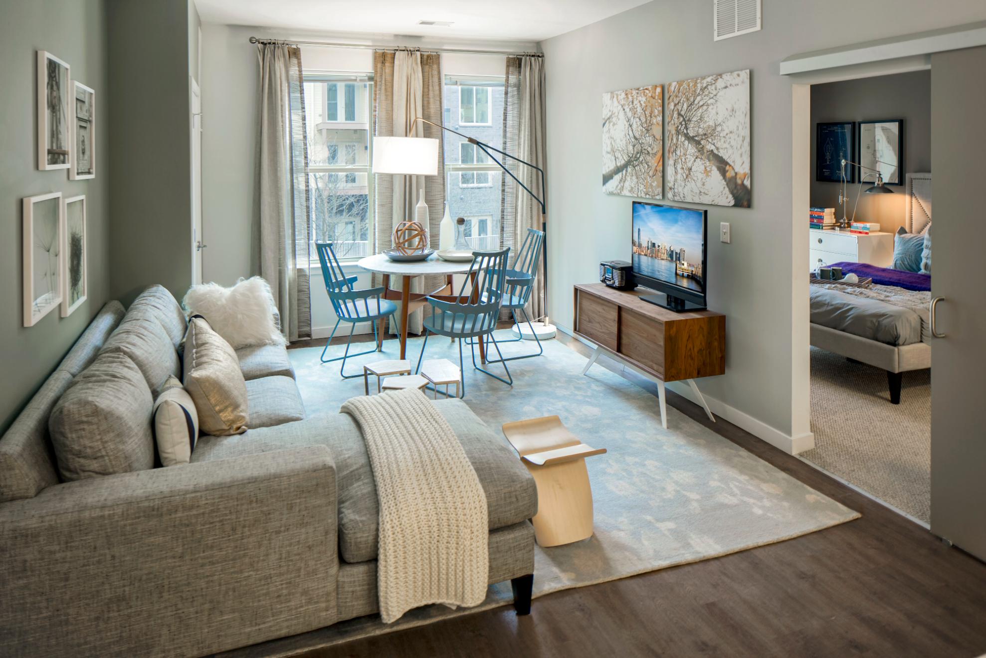 Close-up of stovetop with cookware and upper cabinets