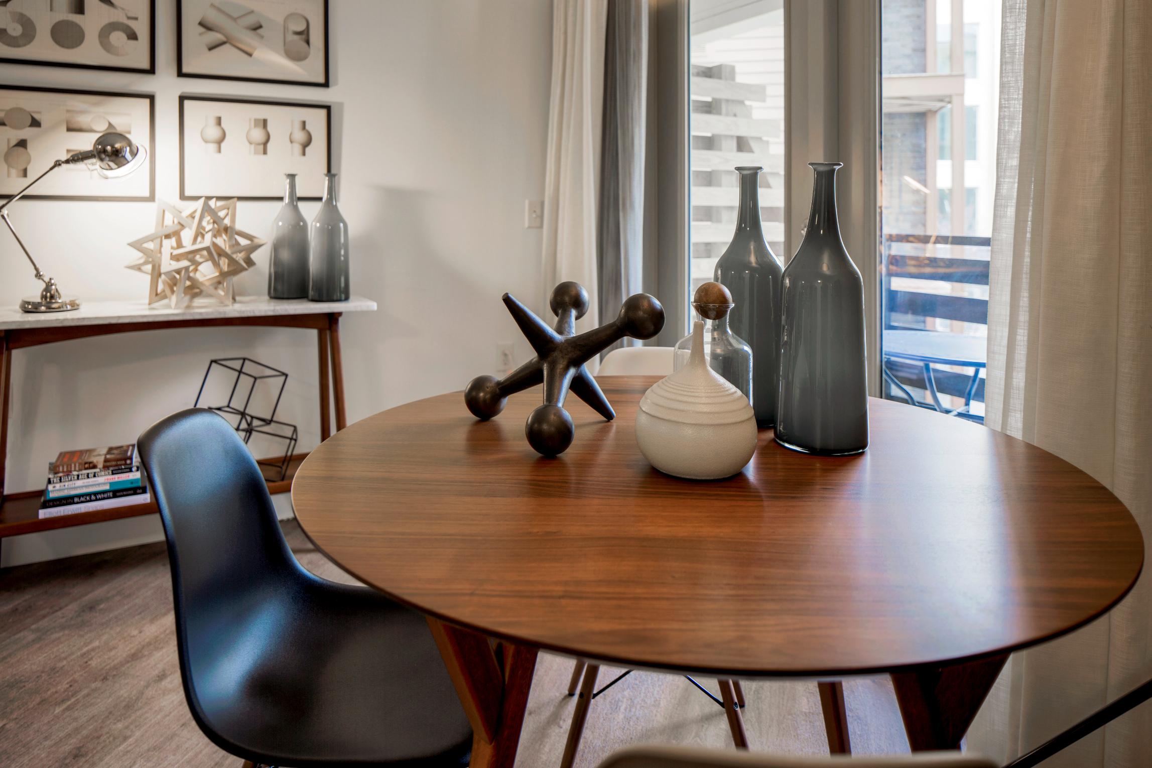 Cozy dining area with a round table, decorative space, and a stylish chair